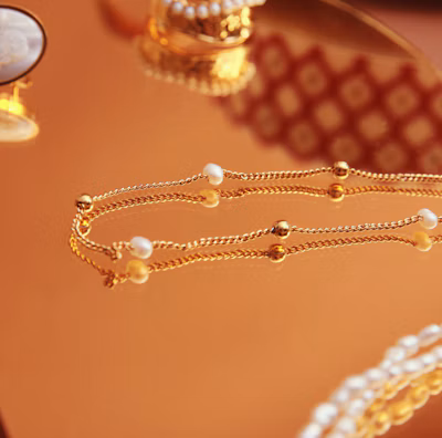 Close-up of luxurious accessories on a marble table.